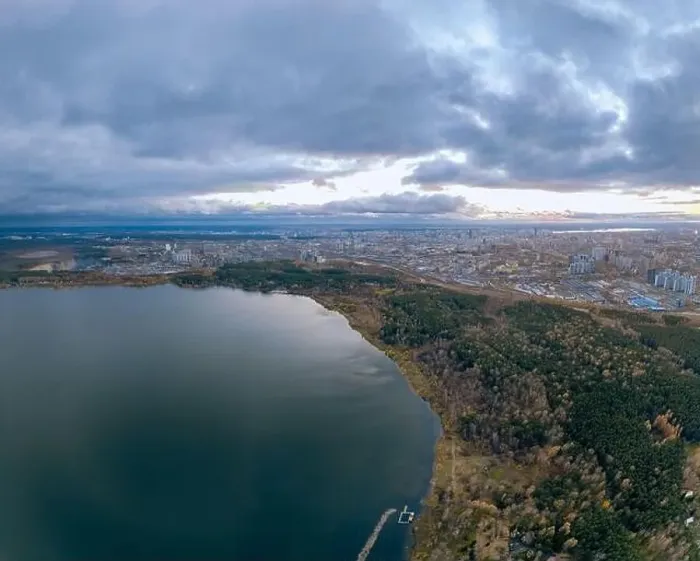 Framed Print : Autumn forest on lake shore at sunset and city on horizon, aerial view. Lake Shartash and Yekaterinburg, Russia Framed Print : Autumn forest on lake shore at sunset and city on horizon, aerial view. Lake Shartash and Yekaterinburg, Russia