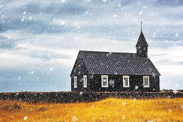 Autumn landscape with snowy famous picturesque black church of Budir at Snaefellsnes peninsula region in Iceland