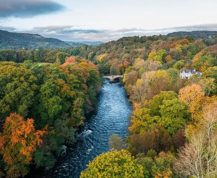 Framed Print : Autumnal landscape with colorful trees and River Dee at sunrise in Wales, UK Framed Print : Autumnal landscape with colorful trees and River Dee at sunrise in Wales, UK