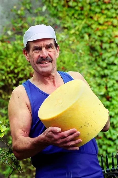 Framed Print : Award winning cheese maker Leon Downey with a finished cheese at Llangloffan Farm Castle Morris Pembrokeshire Wales UK Framed Print : Award winning cheese maker Leon Downey with a finished cheese at Llangloffan Farm Castle Morris Pembrokeshire Wales UK