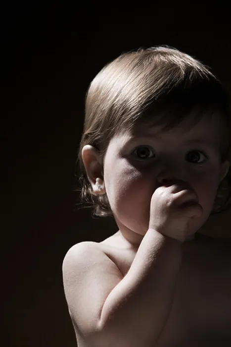 Framed Print : Baby girl sucking her thumb