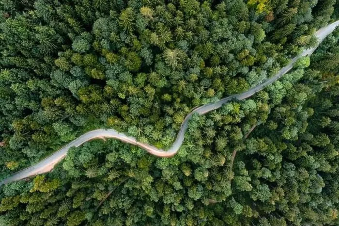 Framed Print : Backlights of a driving car in a curvy road as long exposure from a drone Framed Print : Backlights of a driving car in a curvy road as long exposure from a drone