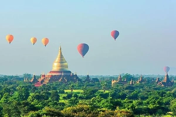 Bagan, Myanmar ancient temple ruins landscape with hot air balloons