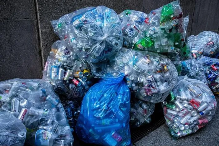 Framed Print : Bags of recycle cans and bottles on the streets on Friday, May 1, 2020. (Photo: Gordon Donovan) Framed Print : Bags of recycle cans and bottles on the streets on Friday, May 1, 2020. (Photo: Gordon Donovan)