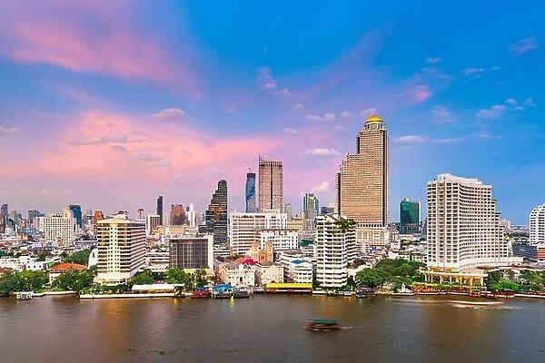 Bangkok, Thailand cityscape over the Chaophraya River at dusk