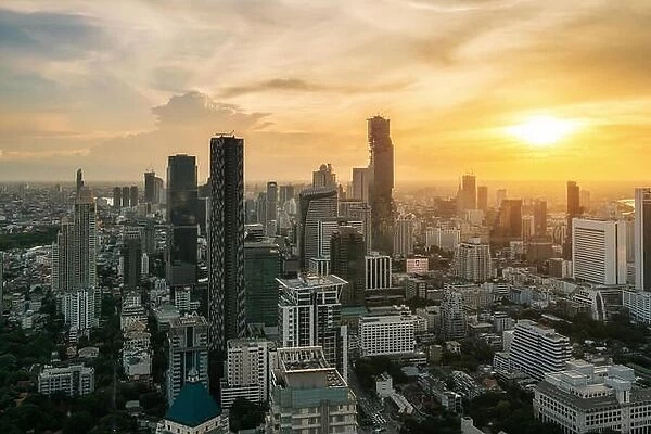Bangkok, Thailand in Downtown area skyline view during sunset time from rooftop in Bangkok. Asian tourism, modern city life, or business finance and e