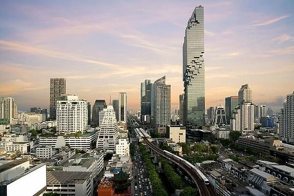Bangkok Transportation before sunset with Modern Business Building from top view in Bangkok, Thailand