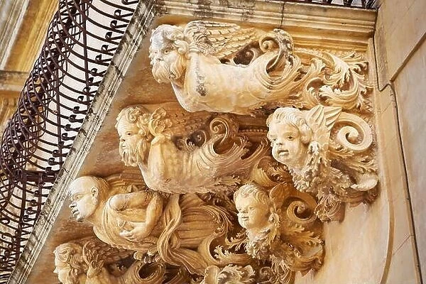 Baroque details of balcony decoration at the Palazzo Villadorata (Palazzo Nicolaci), Noto old town, Sicily, Italy UNESCO