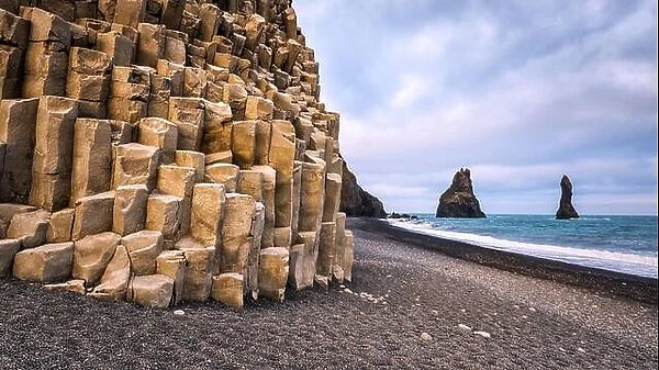 Basalt rock formations 'Troll toes' on black beach. Reynisdrangar, Vik, Iceland
