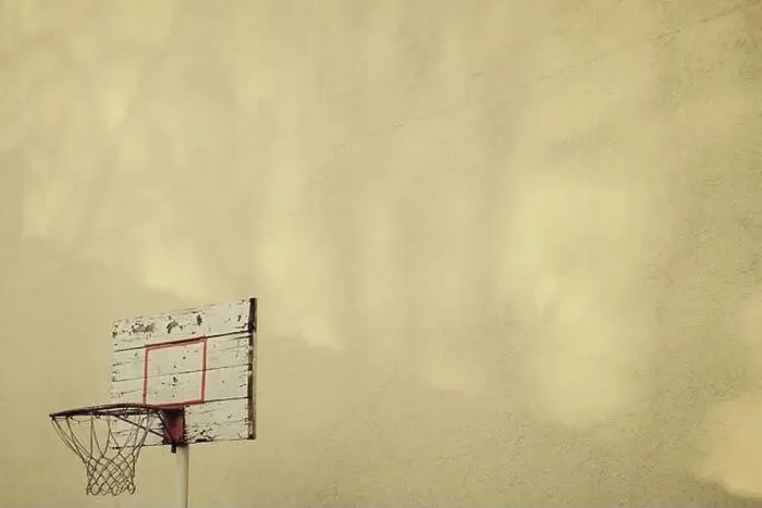 Framed Print : Basketball hoop in the backyard on yellow wall with copy space Framed Print : Basketball hoop in the backyard on yellow wall with copy space