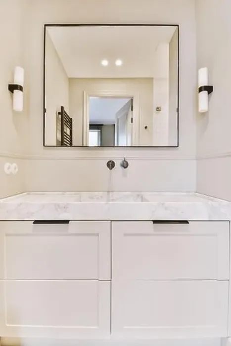 Framed Print : a bathroom with white cabinets and marble counter tops on the vanity top, along with a large mirror above it Framed Print : a bathroom with white cabinets and marble counter tops on the vanity top, along with a large mirror above it