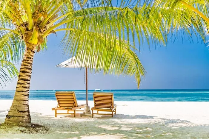 Framed Print : Two beach chairs on white sand under palm tree leaves. Perfect beach landscape, tropical banner for romantic getaway and vacation background Framed Print : Two beach chairs on white sand under palm tree leaves. Perfect beach landscape, tropical banner for romantic getaway and vacation background