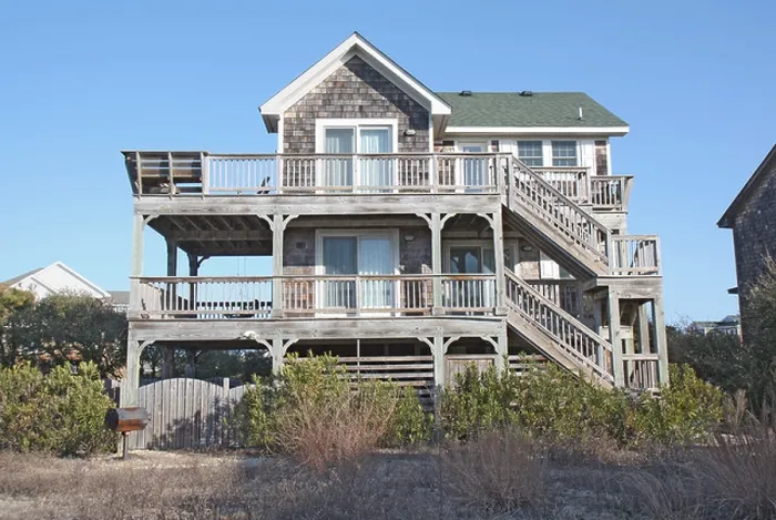 Framed Print : A beach house on the Outer Banks at Nags Head, North Carolina, against a bright blue sky Framed Print : A beach house on the Outer Banks at Nags Head, North Carolina, against a bright blue sky