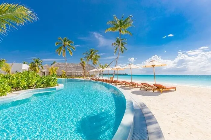 Framed Print : Beach landscape. Luxurious beach resort with swimming pool and beach chairs or loungers under umbrellas with palm trees, vacation, travel holiday Framed Print : Beach landscape. Luxurious beach resort with swimming pool and beach chairs or loungers under umbrellas with palm trees, vacation, travel holiday