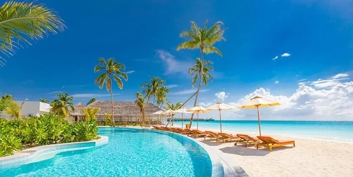 Framed Print : Beach landscape. Luxurious beach resort with swimming pool and beach chairs or loungers under umbrellas with palm trees, vacation, travel holiday Framed Print : Beach landscape. Luxurious beach resort with swimming pool and beach chairs or loungers under umbrellas with palm trees, vacation, travel holiday