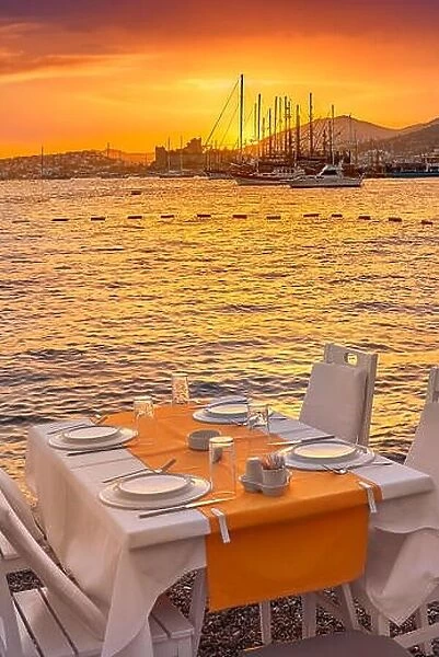 Beach outdoor restaurant at sunset, Bodrum, Turkey