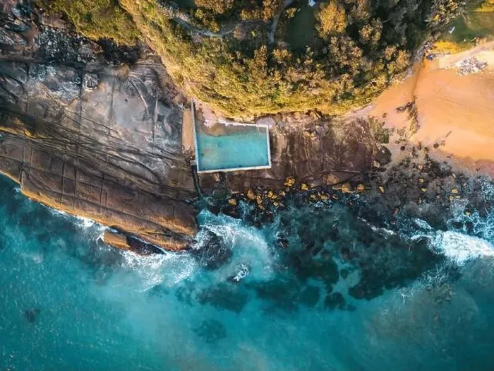 Framed Print : Beach rock pool tidal pool built against the cliff in the rocks at the end of the beach for public swimming recreation Framed Print : Beach rock pool tidal pool built against the cliff in the rocks at the end of the beach for public swimming recreation