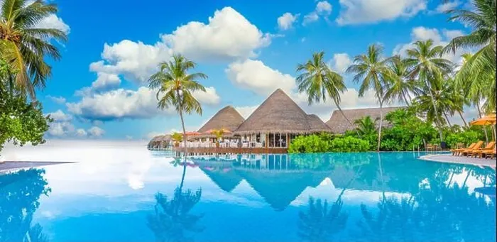 Framed Print : Beachside tourism landscape. Luxurious beach resort poolside, swimming pool and beach chairs beds loungers, umbrellas with tropical palm trees Framed Print : Beachside tourism landscape. Luxurious beach resort poolside, swimming pool and beach chairs beds loungers, umbrellas with tropical palm trees