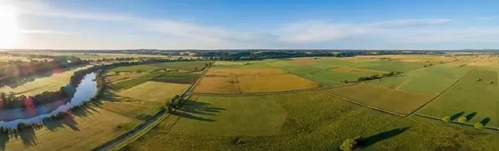 Framed Print : Beautiful aerial panorama of green agricultural fields at sunset in Australia Framed Print : Beautiful aerial panorama of green agricultural fields at sunset in Australia