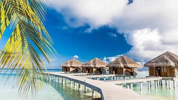 Beautiful beach scene water bungalows. Summer holiday and vacation concept background. Inspirational tropical landscape design