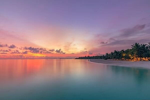 Beautiful bright sunset on a tropical paradise beach. Tranquil summer vacation or holiday landscape. Tropical sunset beach view, calm sea bay
