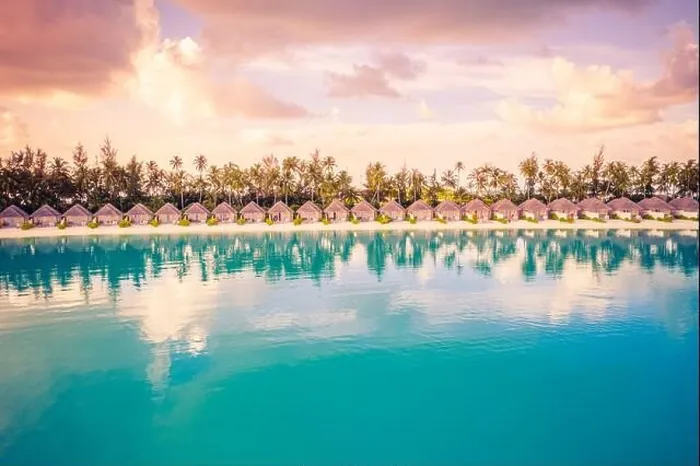 Framed Print : Beautiful colorful sunset at tropical island on Maldives in Indian Ocean. Luxury beach villas with palm trees. Amazing summer destination scenic relax Framed Print : Beautiful colorful sunset at tropical island on Maldives in Indian Ocean. Luxury beach villas with palm trees. Amazing summer destination scenic relax