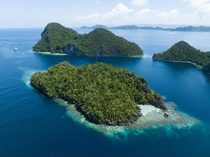 Framed Print : Beautiful and diverse coral reefs surround the dramatic limestone islands that rise from Raja Ampat's varied seascape Framed Print : Beautiful and diverse coral reefs surround the dramatic limestone islands that rise from Raja Ampat's varied seascape