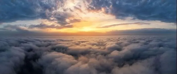 Framed Print : Beautiful dramatic sunset sky above fluffy clouds early in the morning. Drone view Framed Print : Beautiful dramatic sunset sky above fluffy clouds early in the morning. Drone view