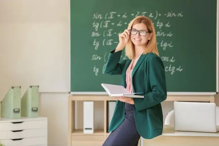 Framed Print : Beautiful female teacher in classroom Framed Print : Beautiful female teacher in classroom