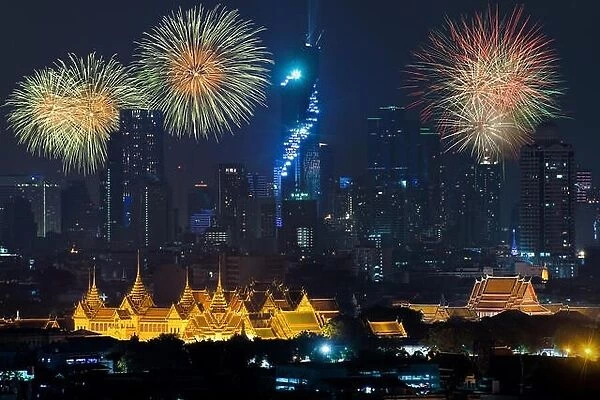 Beautiful fireworks celebrating new year with grand palace and Bangkok city in background at Bangkok, Thailand