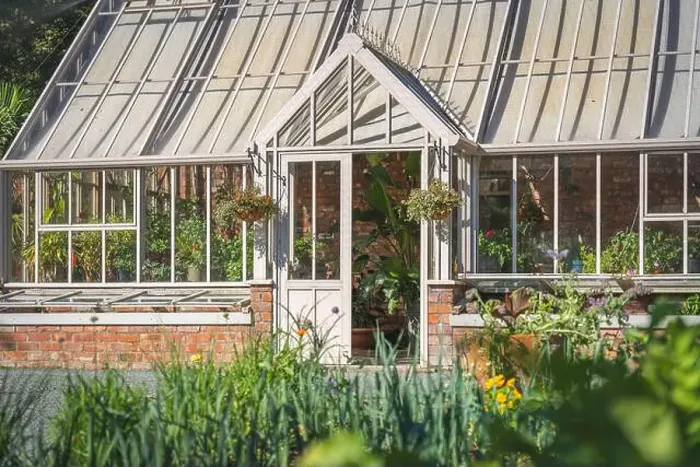 Framed Print : A beautiful formal walled garden with Victorian style greenhouse and vegetable patch in an English country garden Framed Print : A beautiful formal walled garden with Victorian style greenhouse and vegetable patch in an English country garden