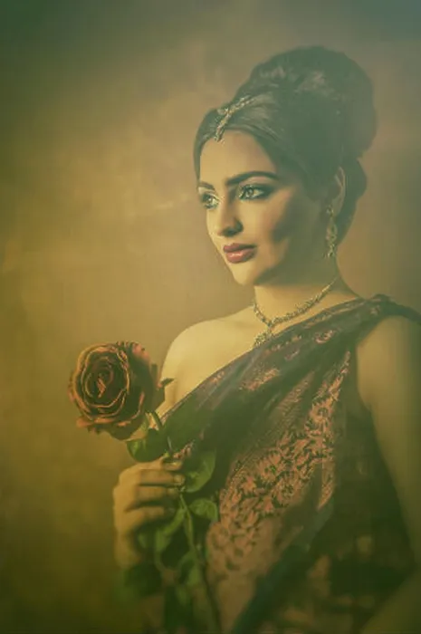 Framed Print : Beautiful Indian woman holding a rose looking away