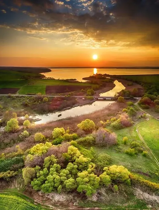 Framed Print : Beautiful landscape with fiery sunset over the lake and river near Burgas, Bulgaria. Aerial view Framed Print : Beautiful landscape with fiery sunset over the lake and river near Burgas, Bulgaria. Aerial view