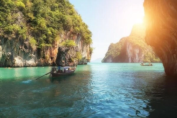 Beautiful landscape of rocks mountain and crystal clear sea with longtail boat at Phuket, Thailand. Summer, Travel, Vacation, Holiday concept