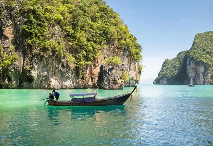 Framed Print : Beautiful landscape of rocks mountain and crystal clear sea with longtail boat at Phuket, Thailand. Summer, Travel, Vacation, Holiday concept Framed Print : Beautiful landscape of rocks mountain and crystal clear sea with longtail boat at Phuket, Thailand. Summer, Travel, Vacation, Holiday concept