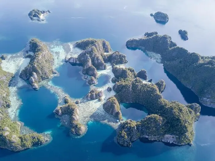 Framed Print : Beautiful limestone islands rise from Raja Ampat's seascape. This remote part of Indonesia is home to the greatest marine biodiversity on Earth Framed Print : Beautiful limestone islands rise from Raja Ampat's seascape. This remote part of Indonesia is home to the greatest marine biodiversity on Earth