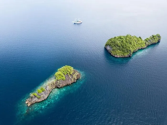 Framed Print : Beautiful limestone islands rise from Raja Ampat's seascape. This remote part of Indonesia is home to the greatest marine biodiversity on Earth Framed Print : Beautiful limestone islands rise from Raja Ampat's seascape. This remote part of Indonesia is home to the greatest marine biodiversity on Earth