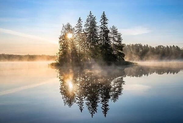Beautiful morning glow with calm landscape with mood sunrise and sunlight at summer morning in Finland
