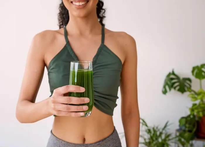 Framed Print : A beautiful multi-ethnic woman smiles with green juice - spinach, kale, vitamans Framed Print : A beautiful multi-ethnic woman smiles with green juice - spinach, kale, vitamans