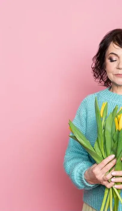 Framed Print : Beautiful old woman with professional smokey make-up and hairstyle holding tulip flowers on the pink background Framed Print : Beautiful old woman with professional smokey make-up and hairstyle holding tulip flowers on the pink background