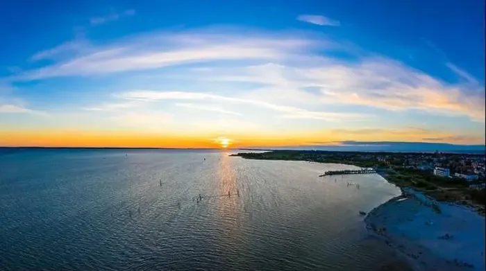 Framed Print : Beautiful Panorama color sky, sunset by the Baltic Sea, Jastarnia, Poland. Aerial View Framed Print : Beautiful Panorama color sky, sunset by the Baltic Sea, Jastarnia, Poland. Aerial View