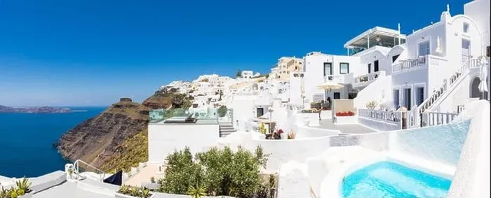 Framed Print : Beautiful panoramic view of picturesque town in Santorini, caldera and volcano on the Mediterranean Sea. Traditional white architecture holiday island Framed Print : Beautiful panoramic view of picturesque town in Santorini, caldera and volcano on the Mediterranean Sea. Traditional white architecture holiday island