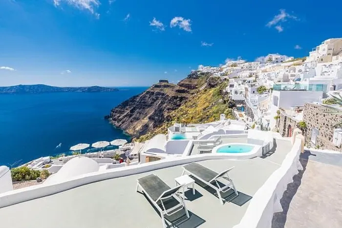 Framed Print : Beautiful panoramic view of picturesque town in Santorini, caldera and volcano on the Mediterranean Sea. Traditional white architecture holiday island Framed Print : Beautiful panoramic view of picturesque town in Santorini, caldera and volcano on the Mediterranean Sea. Traditional white architecture holiday island