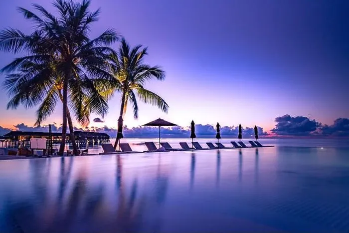 Framed Print : Beautiful poolside and sunset sky. Luxurious tropical beach landscape, deck chairs and loungers and water reflection. Infinity pool, sunset beach view Framed Print : Beautiful poolside and sunset sky. Luxurious tropical beach landscape, deck chairs and loungers and water reflection. Infinity pool, sunset beach view