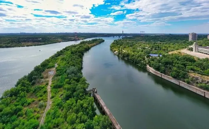 Framed Print : The beautiful river is surrounded by green and fresh vegetation in the city Framed Print : The beautiful river is surrounded by green and fresh vegetation in the city