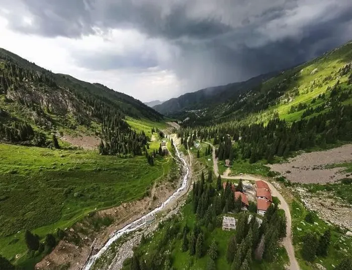 Framed Print : Beautiful scenery of the mountains with green hill and river in at storm rain cloudy sky and resort in Almaty Framed Print : Beautiful scenery of the mountains with green hill and river in at storm rain cloudy sky and resort in Almaty