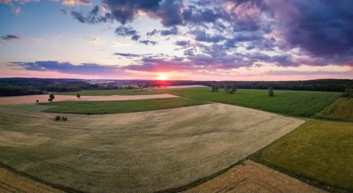 Framed Print : Beautiful summer fields landscape from drone. Sunset over fields and village Framed Print : Beautiful summer fields landscape from drone. Sunset over fields and village
