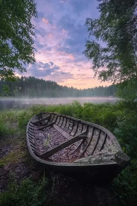 Framed Print : Beautiful sunrise in tranquil lake at summer evening in Finland with wooden boat Framed Print : Beautiful sunrise in tranquil lake at summer evening in Finland with wooden boat