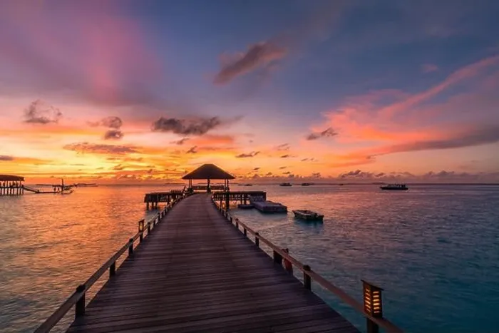 Framed Print : Beautiful sunset beach scene. Colorful sky and clouds view with calm sea and relaxing tropical mood, over water villa. Exotic travel landscape Framed Print : Beautiful sunset beach scene. Colorful sky and clouds view with calm sea and relaxing tropical mood, over water villa. Exotic travel landscape
