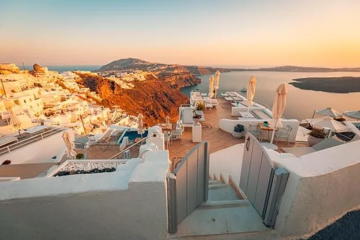 Framed Print : Beautiful sunset at Santorini island, Greece. Chairs on the terrace with sea view. Travel destinations concept. Summer vacation landscape Framed Print : Beautiful sunset at Santorini island, Greece. Chairs on the terrace with sea view. Travel destinations concept. Summer vacation landscape